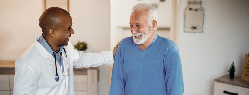 senior man talking with a physician during an appointment