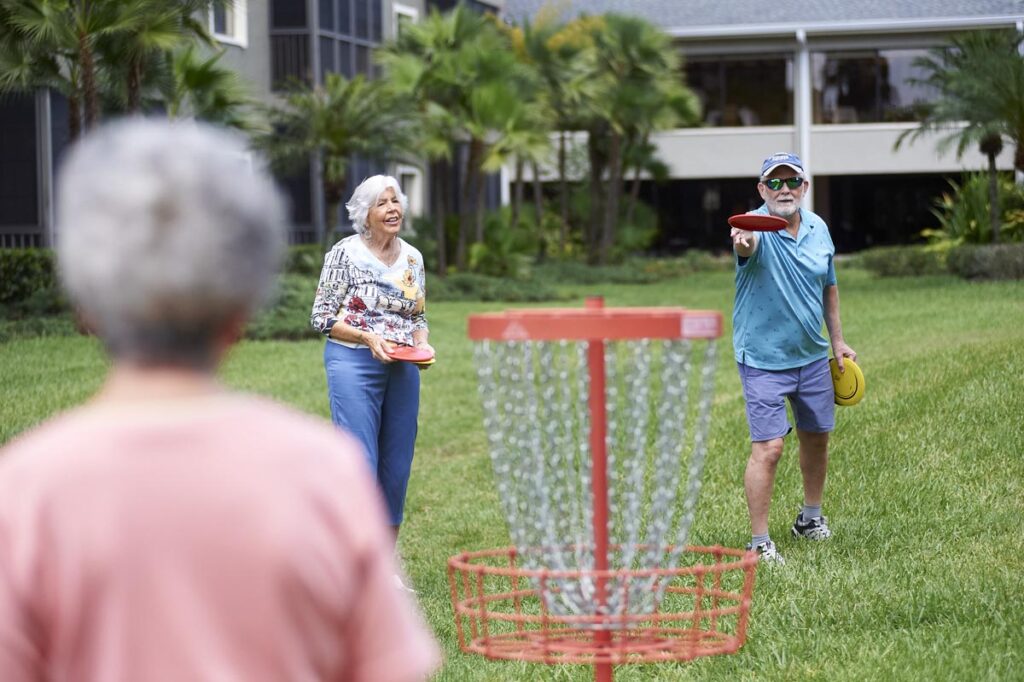 seniors playing frisbee golf