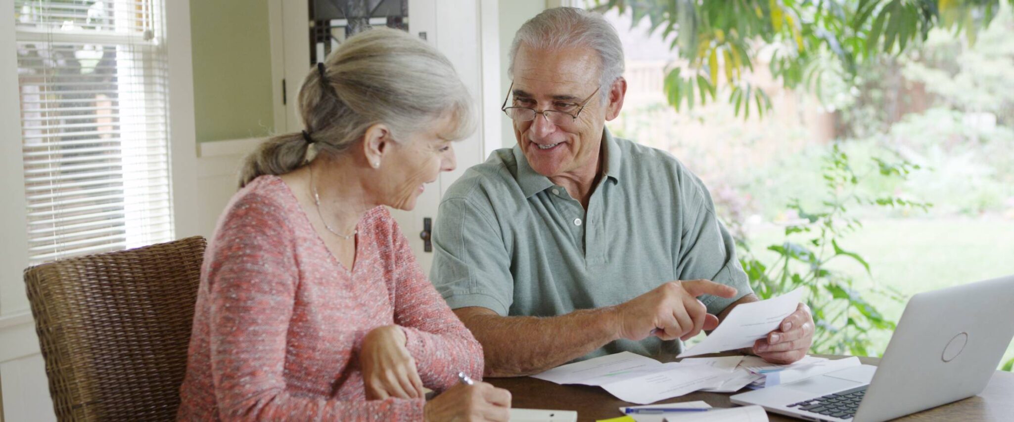 seniors looking at bills and financing