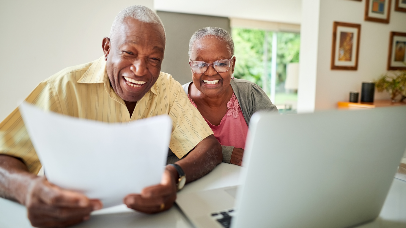 Senior couple reviewing contract paperwork