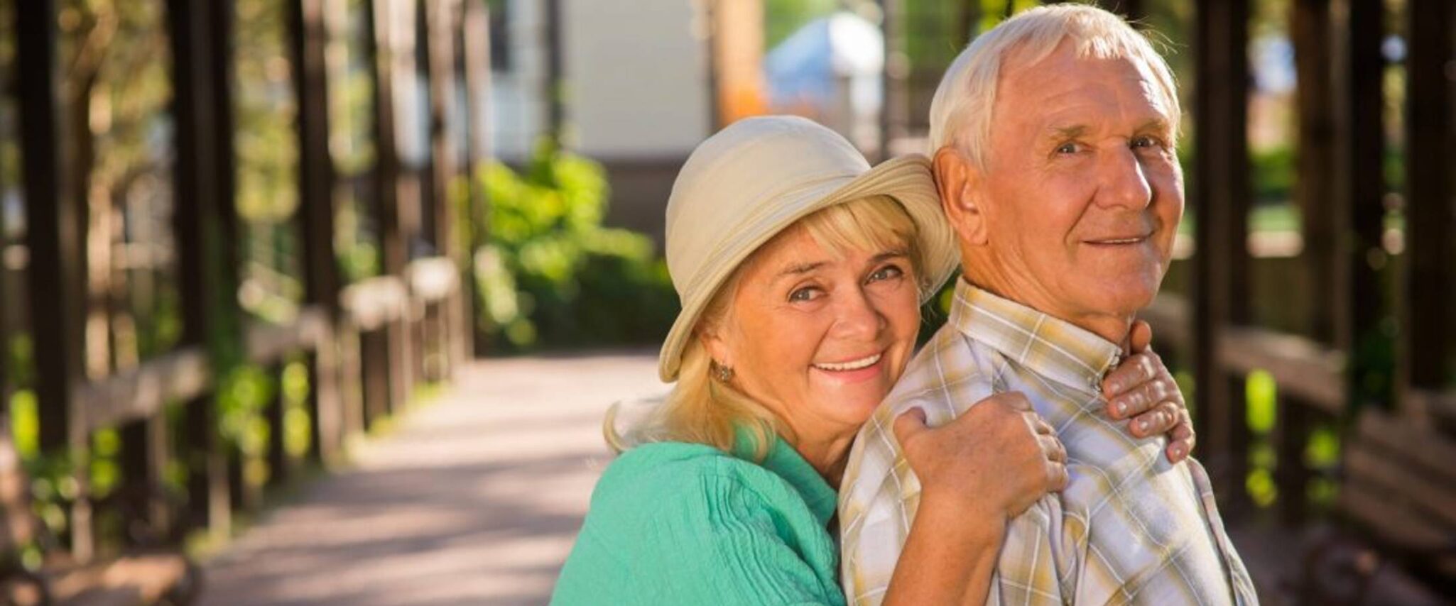 seniors smiling at the camera outside