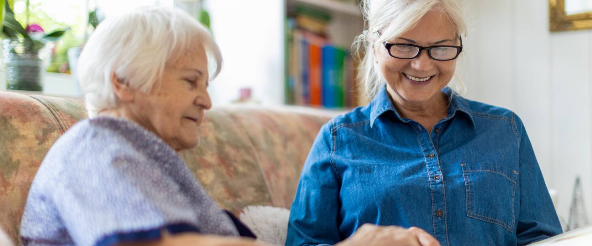 seniors reading and looking at books