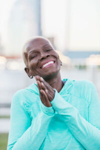 happy senior lady clapping her hands together and smiling