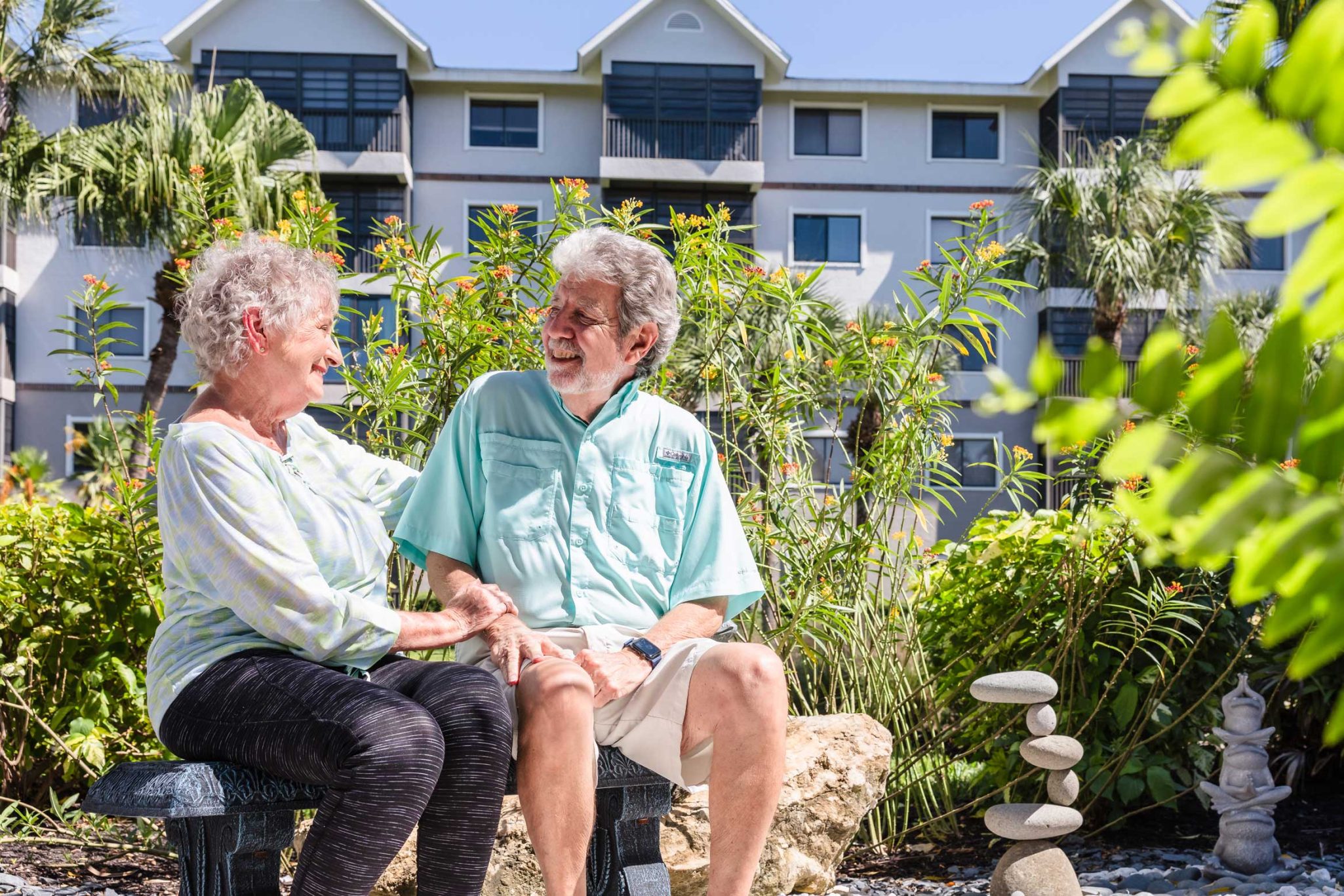 Senior couple sitting on outdoor bench